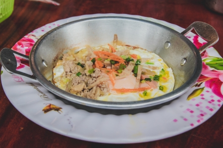 Fried egg stuff with hot pan  Traditional breakfast of Loas people の写真素材
