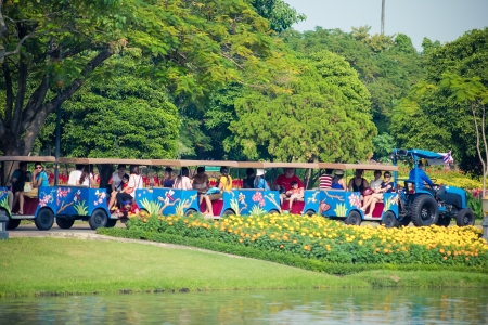 BANGKOK,THAILAND - DECEMBER 15  Thai people and tourists are riding the street tram viewing around the Rama 9 Royal garden on 15 December 2013  The bigest garden in Thailand, many people loves to come here to relax and exercise in every evening のeditorial素材