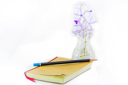 Notebook and pencil isolation on whiteの写真素材