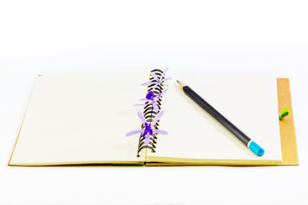 Notebook and pencil isolation on white