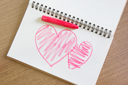 Heart painting on white paper with pastel colorの写真素材
