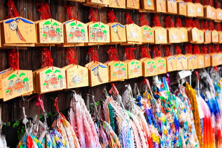 Wood player plate Ema at Fushimi Inari Shrine, Shinto place in Kyoto,Japanのeditorial素材