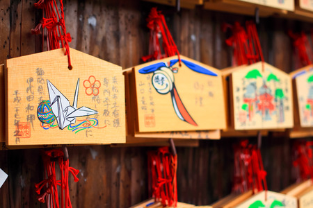 Wood player plate Ema at Fushimi Inari Shrine, Shinto place in Kyoto,Japanのeditorial素材