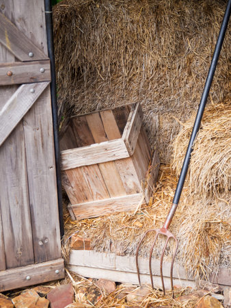 Old vintage tool rake in a store room in a rice filedの写真素材