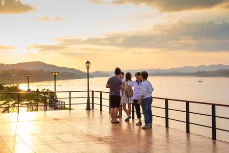 Loei-Thailand: Nov. 2016, Family and Friend gangs visit Khong river, the border of Thai-Loas, to see sunset in Chiangkhan district, Loei, Thailand on 6 November 2016.のeditorial素材