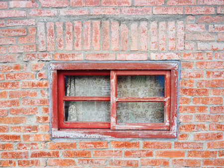 Vintage window with brick wall