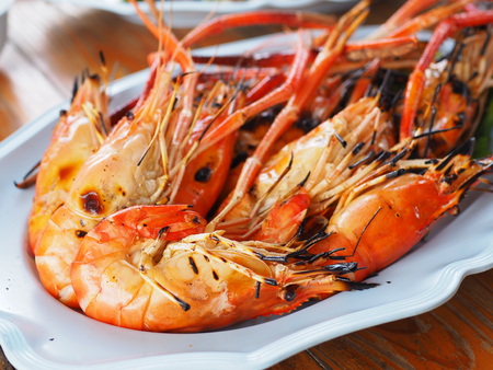 Grilled shrimps on dish, Thai seafood in the restaurantの写真素材