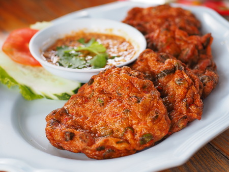 Thai spicy fish cake on plate, appetizer in the restaurantの写真素材