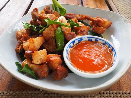 Deep fried pork belly with fish sauce, Thai appetizer, in the restaurantの写真素材