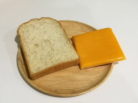 Simply breakfast - bread and cheese - on the wood dish