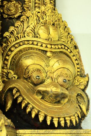 Carving by hand beautiful golden dragon head の写真素材