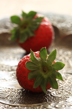 Twin strawberry on the plateの写真素材