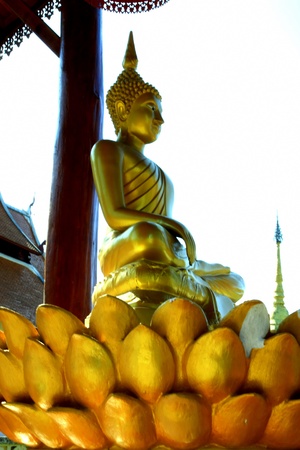 Golden buddha statue on best lotus golden flowerの写真素材