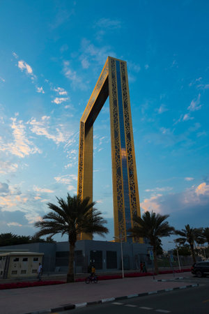 Dubai, UAE - February 25, 2021: Dubai Frame the golden tower building at sunset. Dubai's famous...