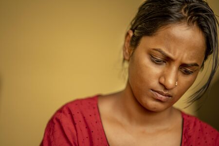 Portrait of serious young woman in homeの写真素材