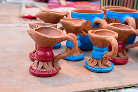Indian traditional handmade clay potsisolated on blurred background are displayed in a street shop...