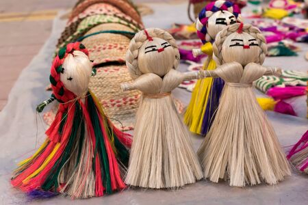 Colourful decorative wall hanging puppet dolls made of jute, handicrafts for sale (Selective Focus)の写真素材