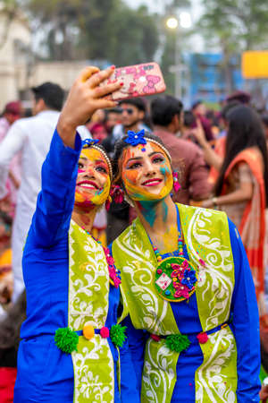 Students are celebrating Holi or 'Basanta Utsav' at Rabindra Bharati University campus in Kolkata, India on 5th March 2020のeditorial素材