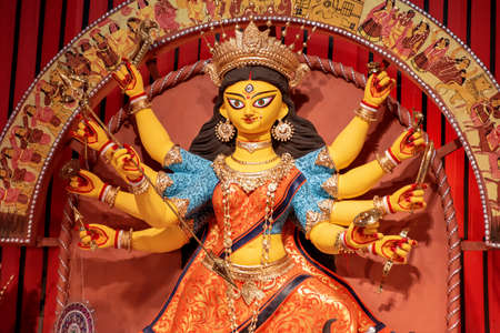 Goddess Durga idol at decorated Durga Puja pandal, shot at colored light, at Kolkata, West Bengal, India. Durga Puja is biggest religious festival of Hinduism and is now celebrated worldwide.のeditorial素材