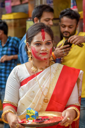 Women participate in Sindur Khela at a puja pandal on the last day of Durga puja at Baghbazar...