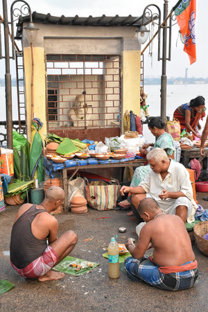 Kolkata, India â€“ September 28 2019; Indian Hindu people do Faithful offer Tarpan to the...