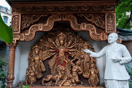 Goddess Durga idol at decorated Durga Puja pandal, shot at colored light, in Kolkata, West Bengal, India. Durga Puja is biggest religious festival of Hinduism and is now celebrated worldwide.の写真素材