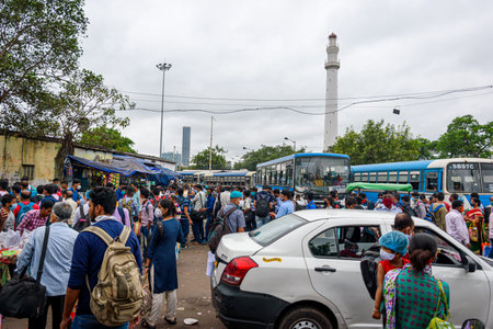 People gathered in the bus stand waiting for the bus with masks during unlock period in Kolkata,...