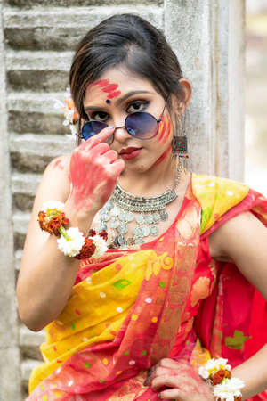 young indian girl Portrait of pretty young indian girl wearing traditional saree and  jewellery, playing with colors and posing fashionable with sunglass on the  festival of colours called Holi.の素材 [FY310165604456] | ストックフォトの Qlean  Market（キュリンマーケット）
