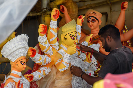 The potters of Kolkata are preparing idols of Goddess Devi Durga and paint those for Durga Puja...