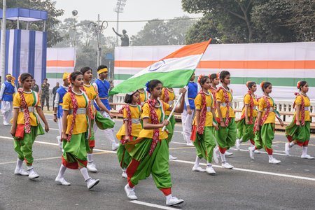 Students with Indian flag preparing for taking part in the upcoming Indian Republic Day parade at Indira Gandhi Sarani, Kolkata, West Bengal, India on January 2023のeditorial素材