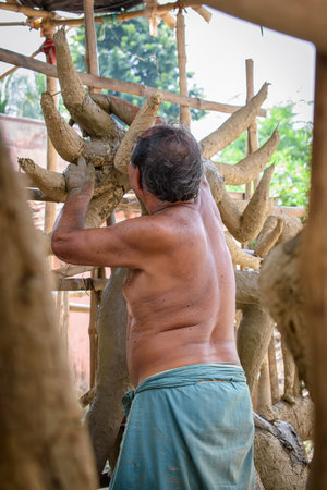 The potters of Krishnanagar are preparing idols of Goddess Devi Durga and paint those for Durga Puja festival, biggest religious festival of Hinduism. West Bengal, India on September 19, 2018.のeditorial素材