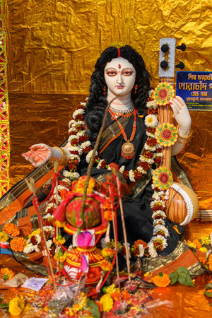 Idol of Goddess Devi Saraswati at a decorated puja pandal in Kolkata, West Bengal, India on February 14, 2024. Saraswati Puja is a popular religious festival of Hinduism.のeditorial素材