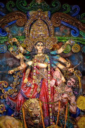 Idol of Goddess Devi Durga at a decorated puja pandal in Kolkata, West Bengal, India on October 21, 2023. Durga Puja is a religious festival of Hinduism that is celebrated across the globe.のeditorial素材