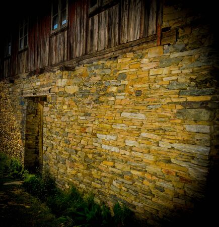 pics of a sikkimese house captured from outside. Door and wall made of stone.の写真素材