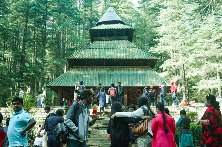 MANALI, INDIA - DECEMBER 9 Tourist come See the sacred Hidimda Devi Temple in Shimla, Kullu, Himachal Pradesh, noerthern India, Asia. Famous view of wooden covered architecture of Himalayan region.のeditorial素材
