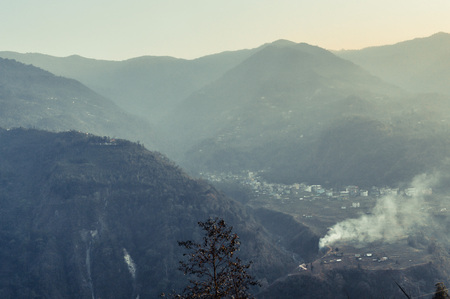 In the jungle to top mountains. Aerial, panoramic view of a forest in the mountains on a foggy day with copy space. Manali, Himachal Pradesh, Indiaの写真素材