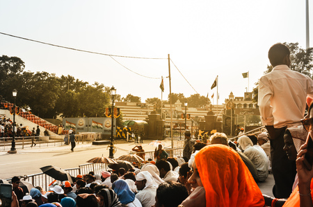 WAGHA BORDER, AMRITSAR, PUNJAB, INDIA - JUNE, 2017. People gathered in the lowering of flags ceremony. Its a daily military practice security forces of India and Pakistan jointly followed since 1959.のeditorial素材