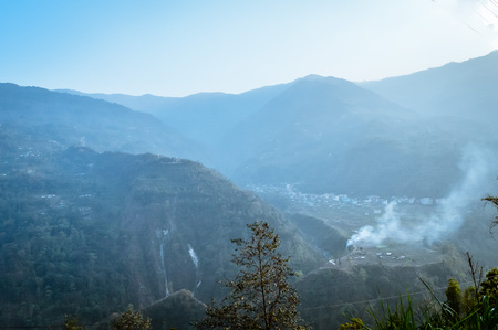 In the jungle to top mountains. Aerial, panoramic view of a forest in the mountains on a foggy day with copy space. Manali, Himachal Pradesh, Indiaの写真素材