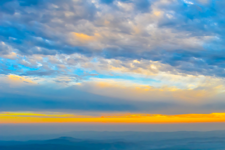 Vibrant color cloud scape on a dramatic sky. Image was captured on a sunny summer day in sunset time. Outdoor travel photography. (Hill station of Darjeeling, West Bengal, India)の写真素材