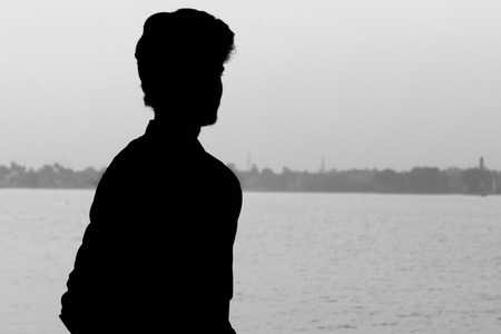 Silhouette man portrait in isolated backgroundの写真素材
