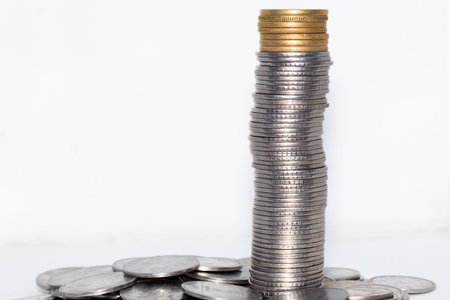 Stock pile of Hundred number 1, 10, 5 Indian rupee metal coin currency on isolated background....