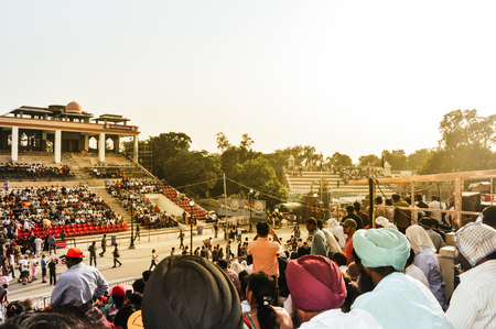 WAGHA BORDER, AMRITSAR, PUNJAB, INDIA - JUNE, 2017. People watching the lowering of flags ceremony. Its a daily military practice security forces of India and Pakistan jointly followed since 1959.のeditorial素材