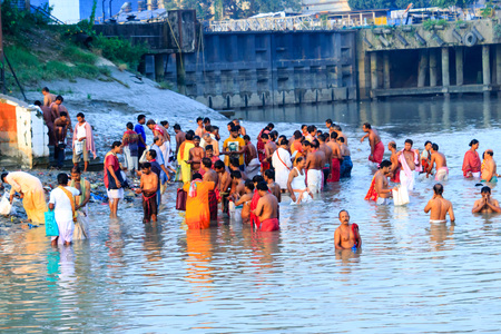 KOLKATA, INDIA - JANUARY 14, 2016: Devotees taking holy dip at Har Ki Pauri on river Ganga on the first bath of Ardh Kumbh fair. People took a dip in holy Ganges on the occasion of Makar Sankrantiのeditorial素材