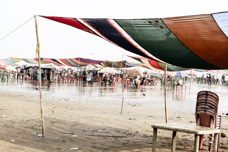 Versova beach, Mumbai India 10, Jan 2019: Beach market View of crowded with tourists and vendors in...