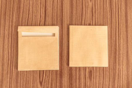 Set of two Brown envelope front and back isolated on wooden table hardwood floor background. Business cards blank. Mockup. Top high angel view object with clipping path. Flat Lay. Copy space for textの写真素材
