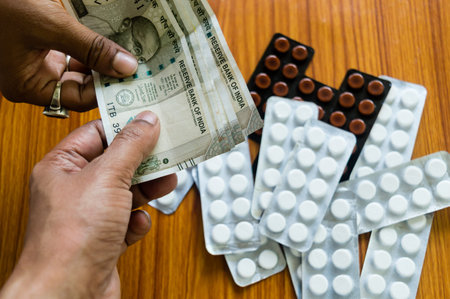 Customer giving money to buy drug at drugstore pharmacy. Close up view. Various capsules, tablets,...