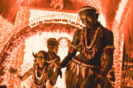 KOLKATA , INDIA SEPTEMBER 26, 2017 - Decorated art and craft sculptures of Traditional tribal Santal or Santhal ethnic group dancers wear traditional clothing in a famous Durga Puja pandal.のeditorial素材