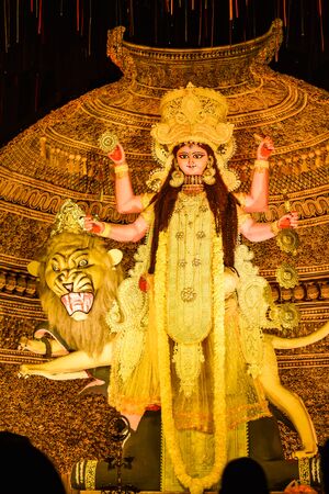 Kolkata West Bengal India October 2018 - Image of goddess devi Maa Durga or Parvati or Uma, wife of Lord Shiva in jewelery and Ceremonial make up during famous Durga Puja (Durgotsava) annual festival.のeditorial素材