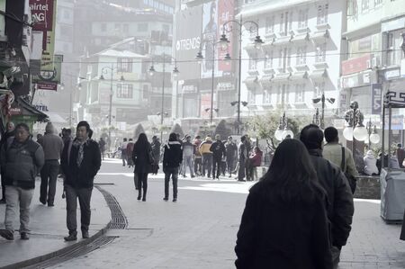 MG MARG Road, Gangtok, Sikkim, India 3rd January 2019 - Crowd of People Walking On Busy City Street. Typical Landscape scenery North East Urban India. Its a popular old hill station to visit.のeditorial素材