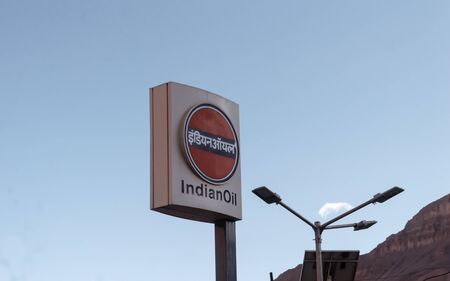 LED Indian Oil Display Sign Board displaying Corporate Logo of Indian Oil Corporation Limited for branding and promotion against clear blue sky background. 30th day of June, Himachal Pradesh, India.のeditorial素材